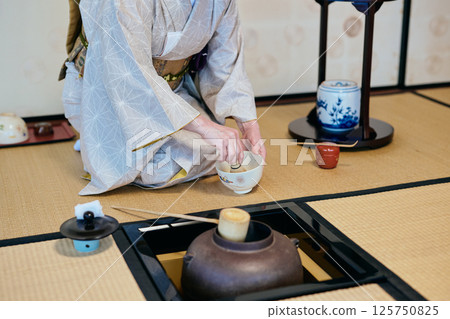 A woman demonstrating tea ceremony A woman demonstrating tea ceremony 125750825