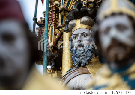 Nuremberg, Germany, August 2, 2023. Detail of one of the many statues that characterize the golden fountain in the market square. Travel destinations and tourist attractions. Nuremberg, Germany, August 2, 2023. Detail of one of the many statues that characterize the golden fountain in the market square. Travel destinations and tourist attractions. 125751175