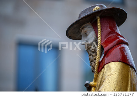 Nuremberg, Germany, August 2, 2023. Detail of one of the many statues that characterize the golden fountain in the market square. Travel destinations and tourist attractions. 125751177