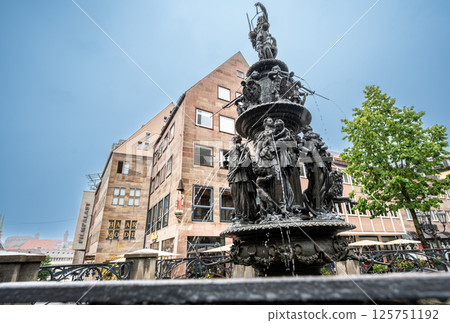 Nuremberg, Germany, August 2, 2023. Shot on a rainy day of the Fountain of the Virtues, near the church of St. Lawrence. Nuremberg, Germany, August 2, 2023. Shot on a rainy day of the Fountain of the Virtues, near the church of St. Lawrence. 125751192