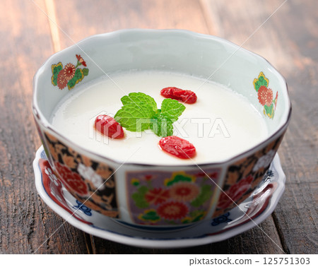 Almond tofu garnished with goji berries and mint Almond tofu garnished with goji berries and mint 125751303