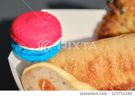 Macaroons and sausages in the colors of the Luxembourg flag 125752280