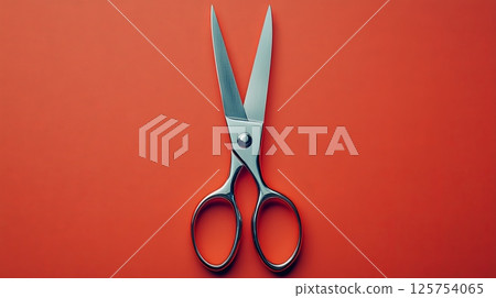 Sharp Scissors on Vibrant Red Background - Office Supplies Concept 125754065