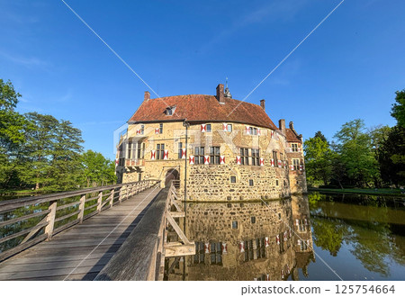 Historic Moated Castle in Germany on a Sunny Day 125754664