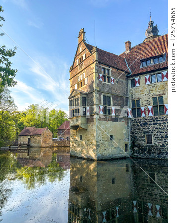 Historic Moated Castle in Germany on a Sunny Day 125754665