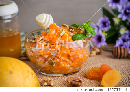 Nutritious Breakfast of Pumpkin with Rice and Nuts 125755444