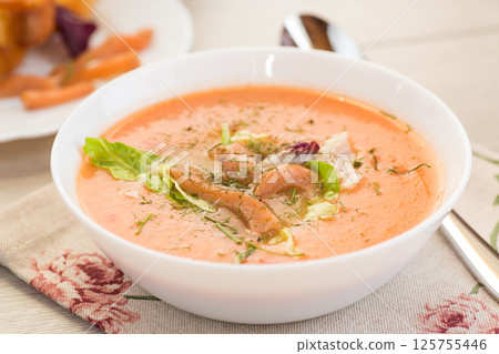 Healthy and delicate cream soup of red fish with dill 125755446