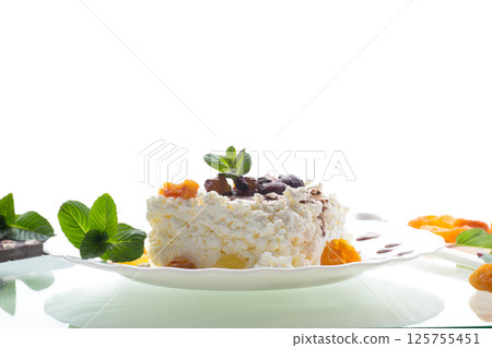 sweet cottage cheese breakfast in a plate with chocolate syrup with candied fruits sweet cottage cheese breakfast in a plate with chocolate syrup with candied fruits 125755451