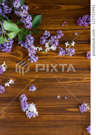 Beautiful spring lilac on wooden background with space for text Beautiful spring lilac on wooden background with space for text 125755491