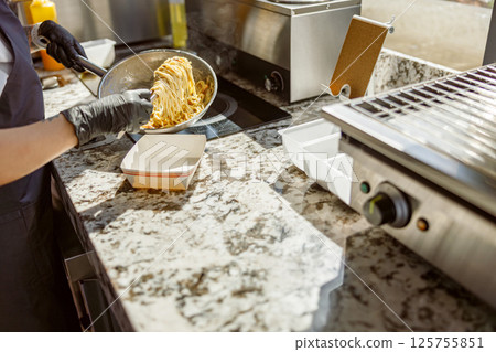 Experience the Joy of Deliciously Grilled Food Preparation Right in a Modern Kitchen 125755851