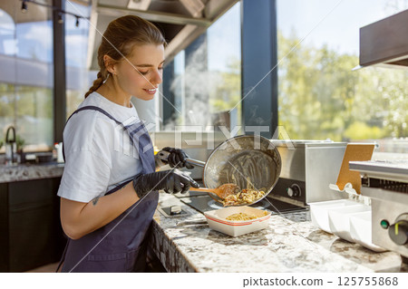 The Art of Culinary Creation in a Contemporary and Modern Kitchen Space Environment 125755868