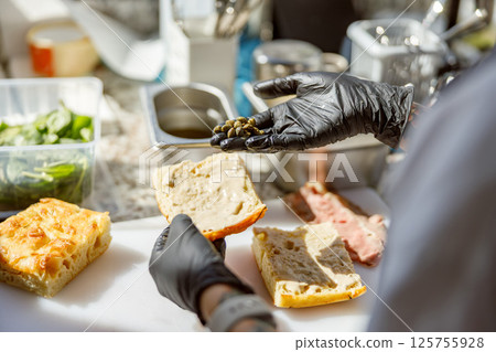 The process of food preparation in a professional kitchen environment is essential for success The process of food preparation in a professional kitchen environment is essential for success 125755928