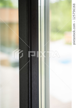 Glass window structure with perforated double glazing and shadowed interior side Glass window structure with perforated double glazing and shadowed interior side 125756168