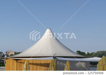 Sunny beach with tent and blue sky in Bulgaria 125756406