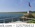 Sunny beach with river and border of Bulgaria and Turkey 125756412
