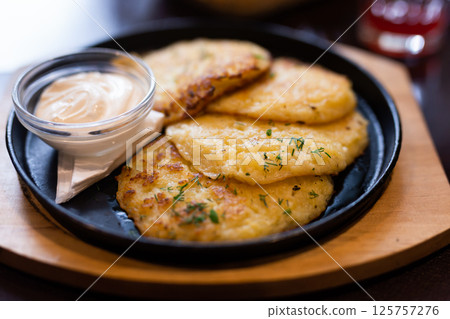 Potato pancakes with sour cream closeup. Belorussian cuisine 125757276