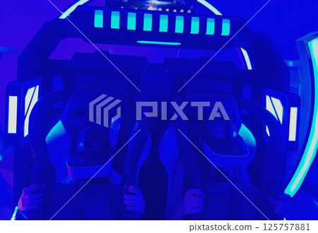 Children having fun from an attraction with virtual reality 125757881