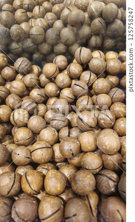 Macadamia nuts are on the counter in a supermarket. Prepared for sale. Macadamia nuts are on the counter in a supermarket. Prepared for sale. 125758247