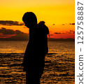 Couple under the tree at dusk Confession Bouquet Engagement Wedding 125758887