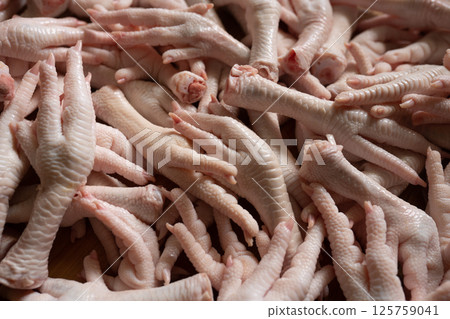 Raw chicken feet for cooking purpose 125759041