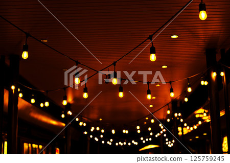 Overhead decorated with light bulbs 125759245