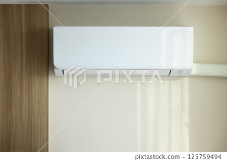 Air conditioner in room for cool climate. Air conditioner in room for cool climate. 125759494