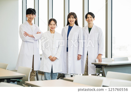 Portrait of young male and female medical students in white coats 125760556