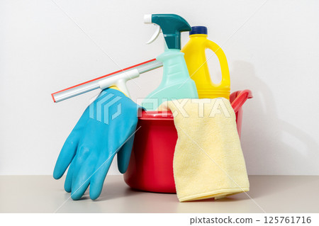 Set of Cleaning supplies in red bucket 125761716