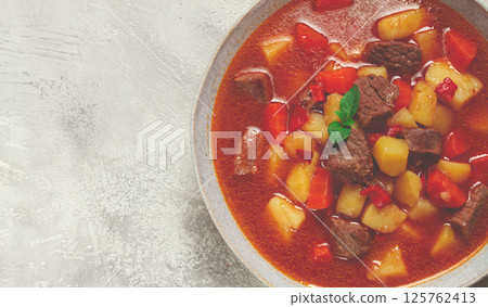 meat goulash, with potatoes and carrots, sweet pepper, traditional Hungarian soup, homemade, no people, 125762413