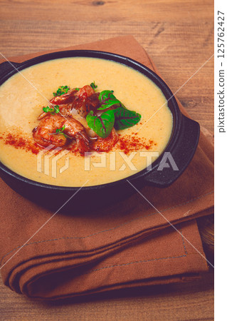 pumpkin cream soup with shrimp, herbs and spices, homemade, no people, 125762427