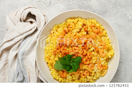 risotto with shrimp, in a bowl, on a textured surface, with a side dish of fresh coriander, homemade, no people, risotto with shrimp, in a bowl, on a textured surface, with a side dish of fresh coriander, homemade, no people, 125762431