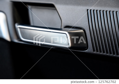 Car door with door handle and window control and adjustment button Car door with door handle and window control and adjustment button 125762702