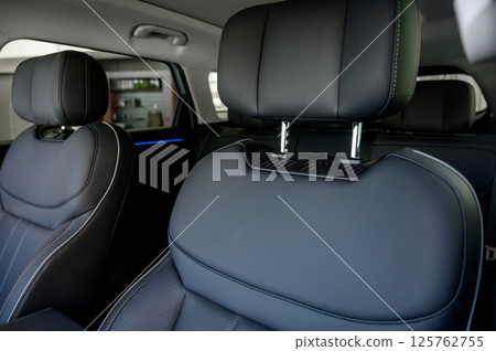 Interior of a modern car with black leather seats 125762755