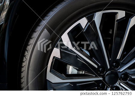 Car wheel with brake calipers and stylish design. Car wheel with brake calipers and stylish design. 125762793