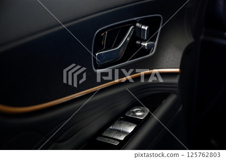 Car door with door handle and window control and adjustment button Car door with door handle and window control and adjustment button 125762803