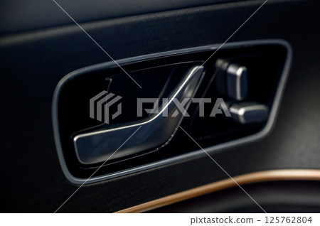 Car door with door handle and window control and adjustment button Car door with door handle and window control and adjustment button 125762804
