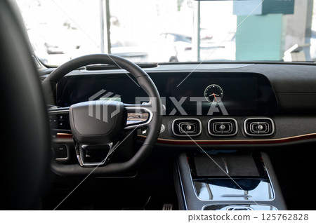 Car interior - steering wheel, shift lever and dashboard. Car modern inside. Car interior - steering wheel, shift lever and dashboard. Car modern inside. 125762828