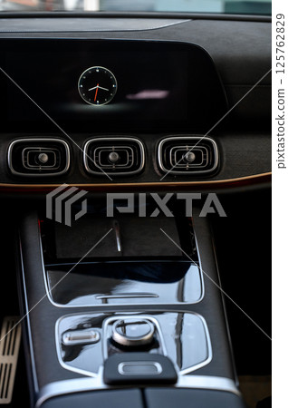 Car interior - steering wheel, shift lever and dashboard. Car modern inside. Car interior - steering wheel, shift lever and dashboard. Car modern inside. 125762829