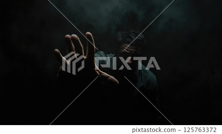 Man With A Haunting Presence In The Darkness 125763372