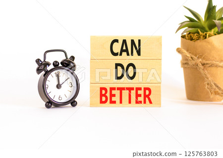 Can do better symbol. Concept words Can do better on beautiful wooden block. Black alarm clock. Beautiful white background. Business and can do better concept. Copy space. Can do better symbol. Concept words Can do better on beautiful wooden block. Black alarm clock. Beautiful white background. Business and can do better concept. Copy space. 125763803