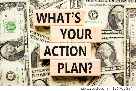 Action plan symbol. Concept words What is your action plan on beautiful wooden blocks. Dollar bills. Beautiful background from dollar bills. Business What is your action plan concept. Copy space Action plan symbol. Concept words What is your action plan on beautiful wooden blocks. Dollar bills. Beautiful background from dollar bills. Business What is your action plan concept. Copy space 125763854