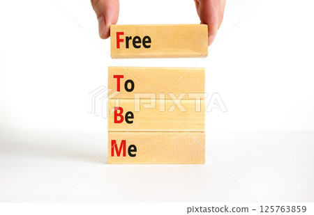 FTBM Free To Be Me symbol. Concept word FTBM Free To Be Me on beautiful wooden blocks. Beautiful white background. Business motivational FTBM Free To Be Me concept. Copy space. 125763859