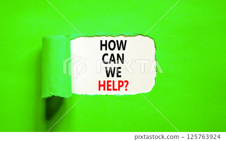 How can we help symbol. Concept words How can we help on beautiful white paper. Beautiful green table green background. Business and how can we help concept. Copy space. 125763924