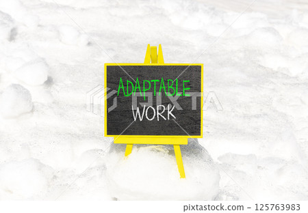 Adaptable work symbol. Concept words Adaptable work on beautiful yellow blackboard. Beautiful white snow background. Business Adaptable work concept. Copy space. Adaptable work symbol. Concept words Adaptable work on beautiful yellow blackboard. Beautiful white snow background. Business Adaptable work concept. Copy space. 125763983