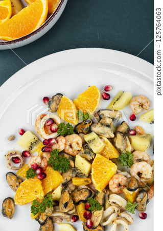 Spicy seafood salad with fruits. Spicy seafood salad with fruits. 125764063