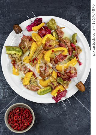 Appetizing vegetarian kebabs from rhubarb stalks. 125764070