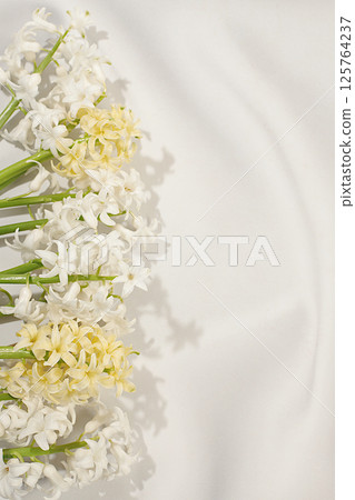 Beautiful flyer made of different varieties of hyacinths. Abstract flower arrangement for screen and design template. Spring card, business card for product demonstration, gift for loved ones 125764237