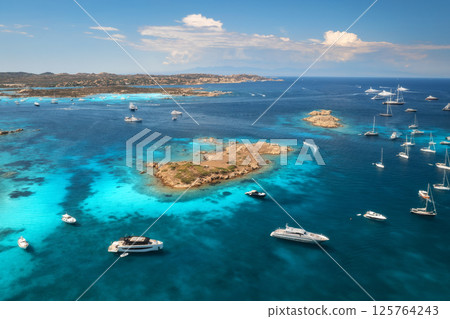 Aerial view of luxury yachts and boats in blue sea in summer 125764243