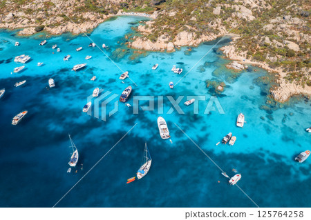 Aerial view of luxury yachts and boats in blue sea in summer 125764258