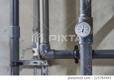 Close-up of a Brass Industrial Pressure Gauge Measuring in Bar Close-up of a Brass Industrial Pressure Gauge Measuring in Bar 125764943